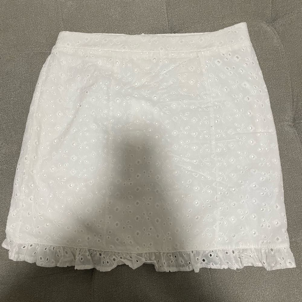 Francesca’s short white skirt